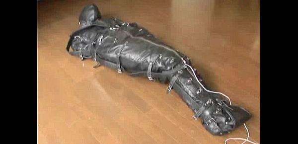  Ballgagged asian girl tied into a leather sleepsack teased and vibed